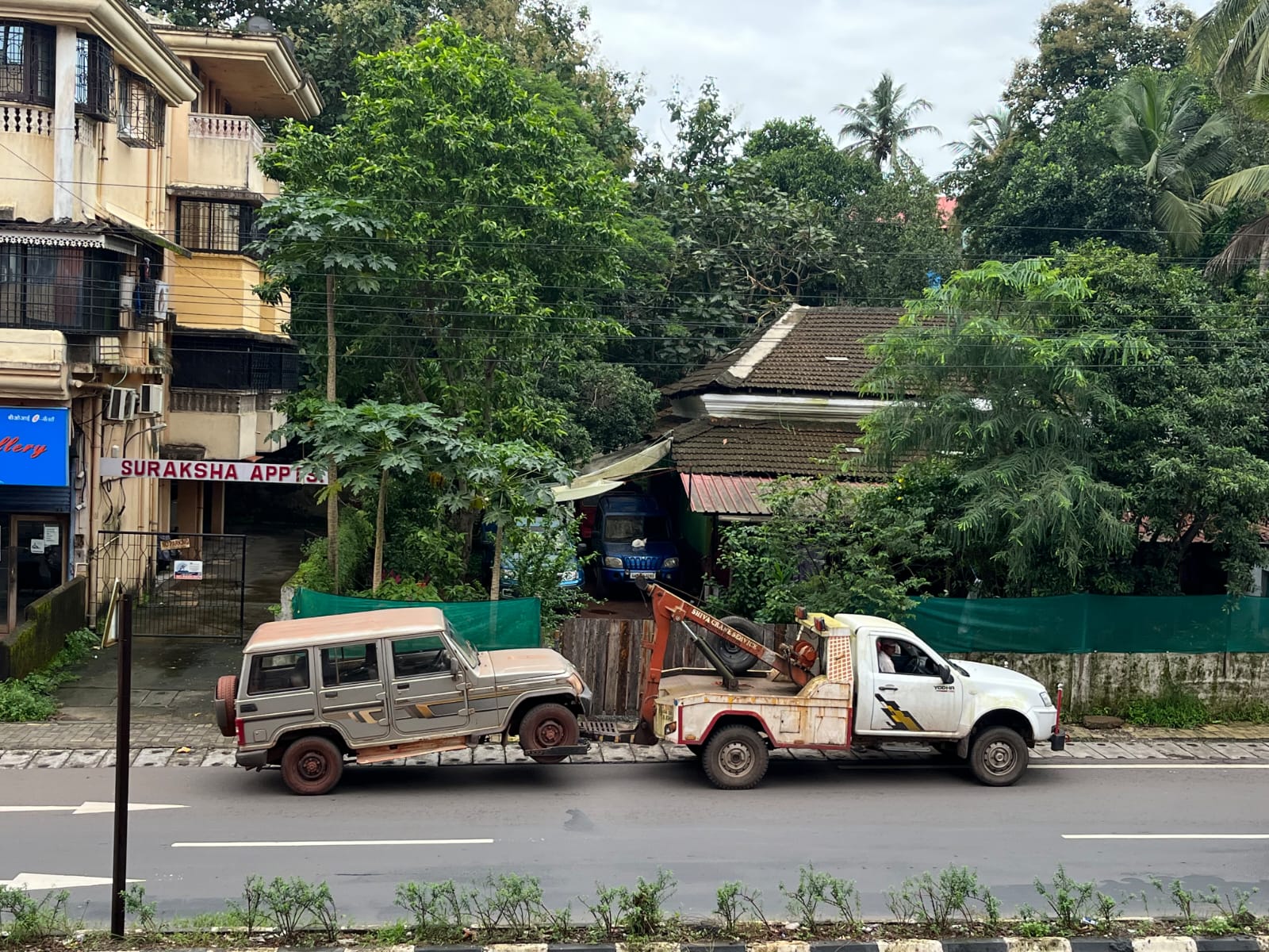 Tow truck recovering broken down vehicle on Goa road
